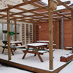 Snowy Pergola Photo - Winter Outdoor Space Maintenance